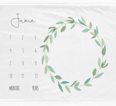 a calendar with a wreath of leaves on it